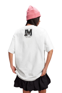 Model wearing MEDM SS25 Basic Gem Series Tee in white with a stylish back design and a pink beanie