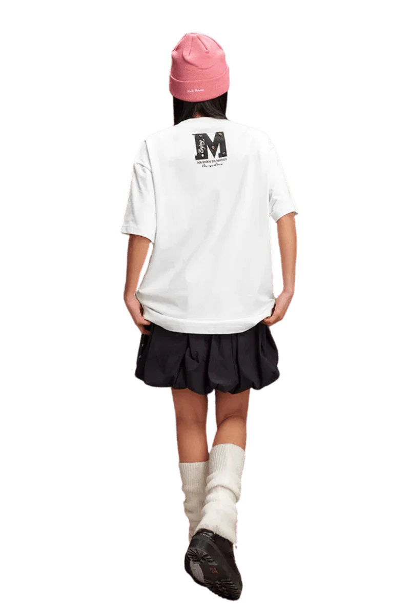 Girl wearing a white MEDM SS25 Basic Gem Series Tee with a stylish black skirt and pink beanie