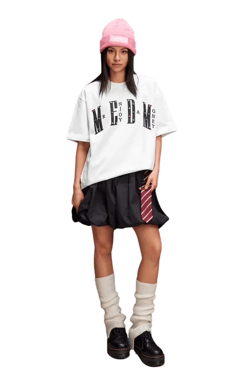 Stylish model wearing the MEDM SS25 Basic Gem Series Tee with a relaxed fit and black skirt