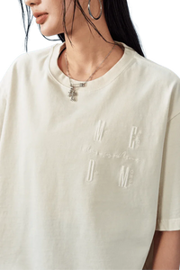 MEDM SS25 Basic Logo Washed Tee in cream color featuring embroidered logo detail on the chest