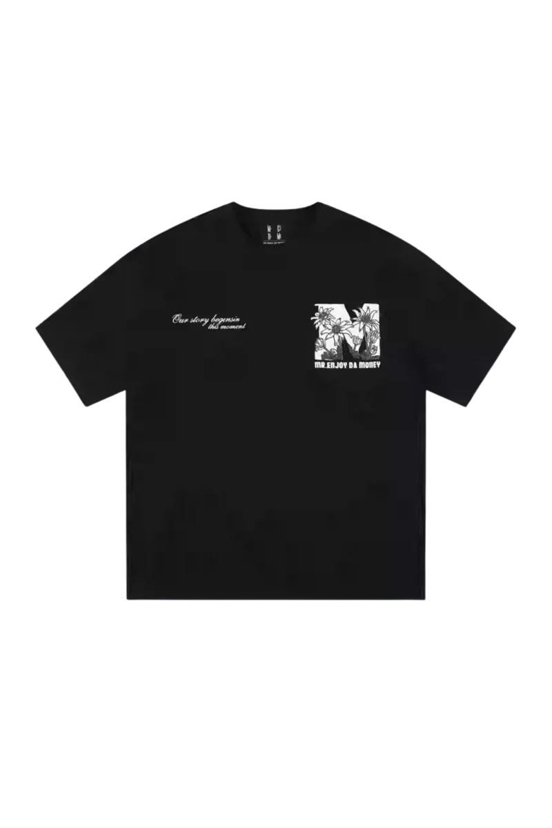 MEDM SS25 Big M Daisy Print Tee in black featuring a unique graphic design on the chest