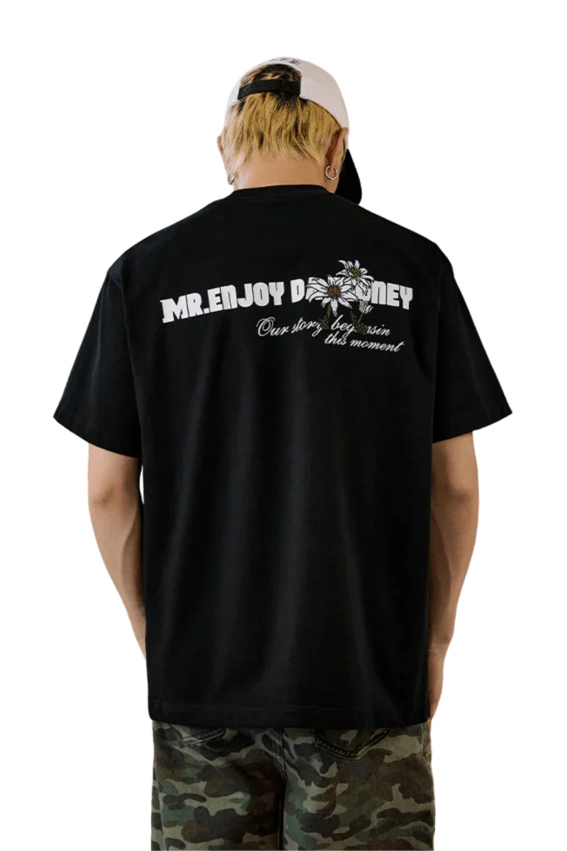 MEDM SS25 Big M Daisy Print Tee in black featuring logo on the back for casual streetwear style