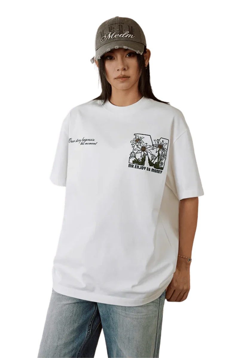 MEDM SS25 Big M Daisy Print Tee in White with Casual Fit and Graphic Design