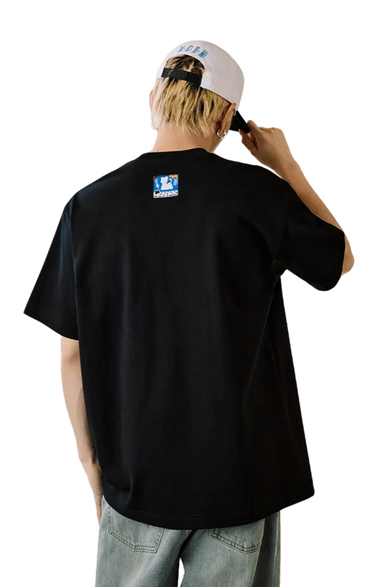 Back view of MEDM SS25 Cat Velcro Embroidery Tee in black worn by a model