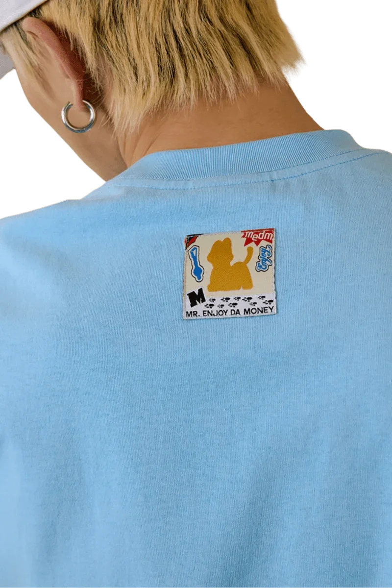 Back view of MEDM SS25 Cat Velcro Embroidery Tee in light blue featuring a unique embroidered patch
