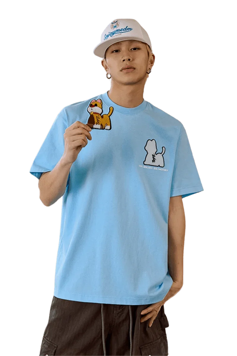 Model wearing MEDM SS25 Cat Velcro Embroidery Tee in light blue with cute animal designs