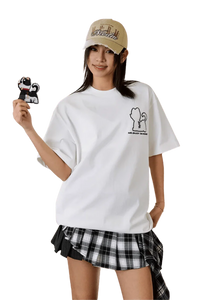 MEDM SS25 Cat Velcro Embroidery Tee in white worn casually with a plaid skirt and accessories