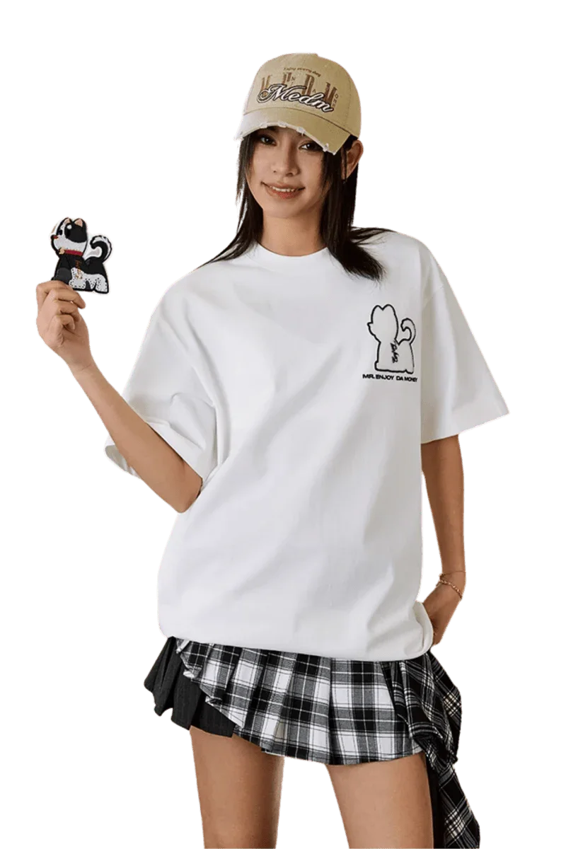 MEDM SS25 Cat Velcro Embroidery Tee in white worn casually with a plaid skirt and accessories