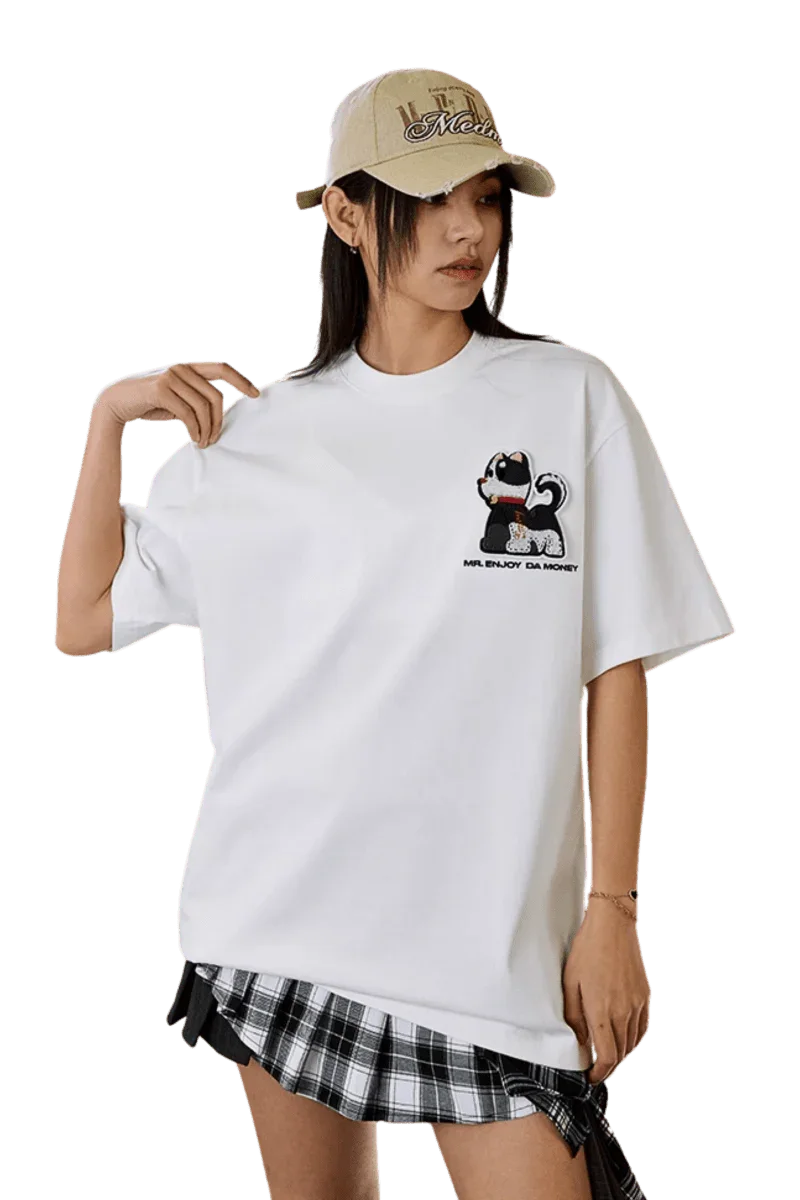 Model wearing the MEDM SS25 Cat Velcro Embroidery Tee in white featuring a playful cat design
