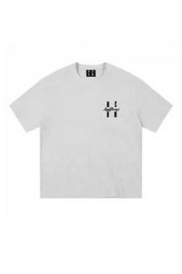 MEDM SS25 Felt Embossed Basic Tee in light gray featuring a bold logo design on the front.