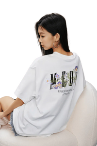 MEDM SS25 Floral Embroidery Tee in white featuring vibrant floral design on the back