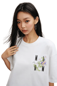 MEDM SS25 Floral Embroidery Tee featuring a stylish design on a white t-shirt for casual wear
