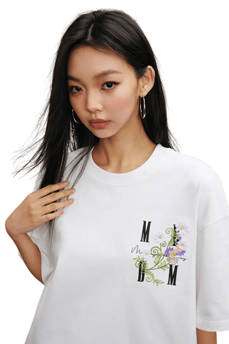 MEDM SS25 Floral Embroidery Tee featuring a stylish design on a white t-shirt for casual wear