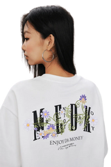 MEDM SS25 Floral Embroidery Tee featuring vibrant floral designs on a white background