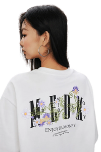 MEDM SS25 Floral Embroidery Tee featuring vibrant floral designs on a white background