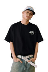 Men's MEDM SS25 Floral Felt Embossed Tee in Black, styled for a casual look.