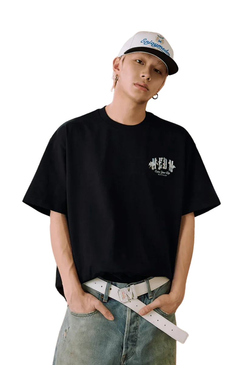 Men's MEDM SS25 Floral Felt Embossed Tee in Black, styled for a casual look.