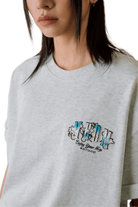 MEDM SS25 Floral Felt Embossed Tee in grey with stylish graphic design for casual wear
