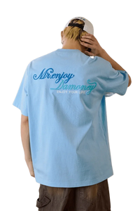 MEDM SS25 Four Color Velvet Embossed Tee in light blue with stylish logo on the back