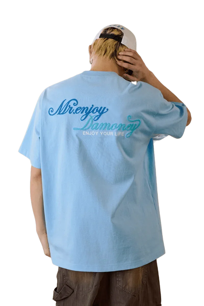 MEDM SS25 Four Color Velvet Embossed Tee in light blue with stylish logo on the back