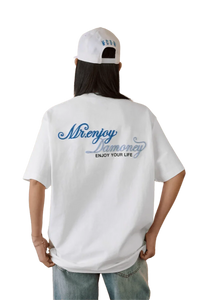 Back view of a person wearing a white MEDM SS25 Four Color Velvet Embossed Tee with Mr Enjoy Da Money logo
