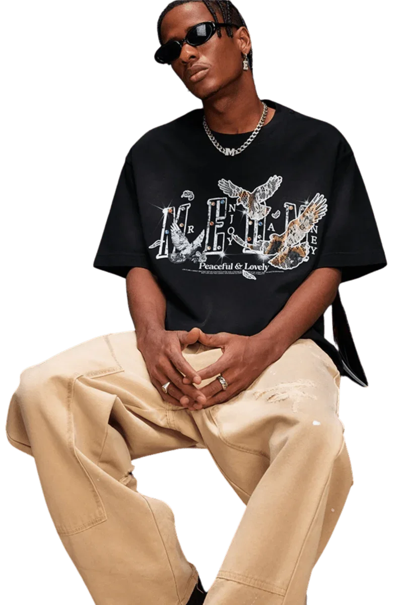 Mr Enjoy Da Money MEDM SS25 Lace Pigeon Gem Tee styled with casual pants and sunglasses