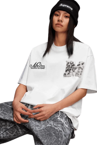 Mr Enjoy Da Money MEDM SS25 Leopard Fur Big M Tee in white, worn with stylish gray patterned pants