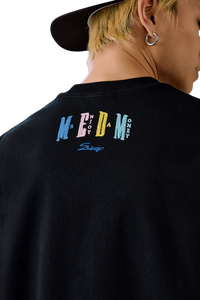 Black MEDM SS25 Macaron Velvet Embossed Tee featuring colorful logo on the back for a trendy look