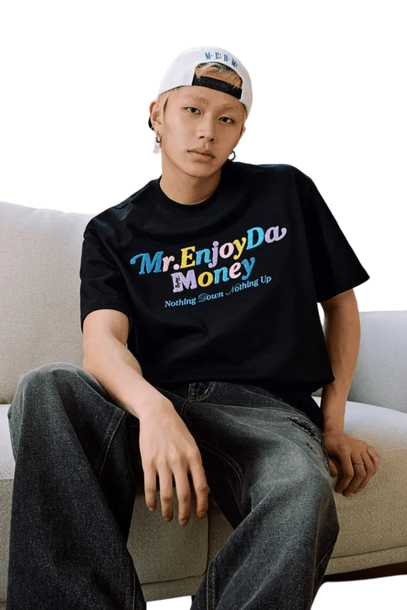 Stylish MEDM SS25 Macaron Velvet Embossed Tee in black worn by a model with relaxed fit jeans