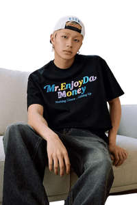 Stylish MEDM SS25 Macaron Velvet Embossed Tee in black worn by a model with relaxed fit jeans