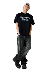 MEDM SS25 Macaron Velvet Embossed Tee in black worn with loose denim jeans for a casual look