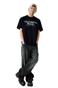 MEDM SS25 Macaron Velvet Embossed Tee in black worn with loose denim jeans for a casual look