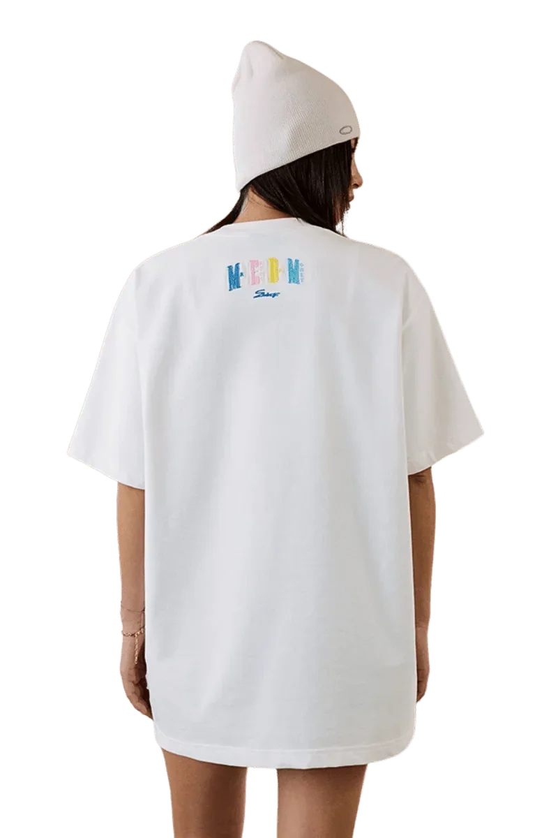 Woman wearing MEDM SS25 Macaron Velvet Embossed Tee in white, showcasing the stylish back design.
