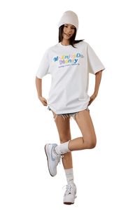 Model wearing MEDM SS25 Macaron Velvet Embossed Tee with stylish denim shorts for a trendy look