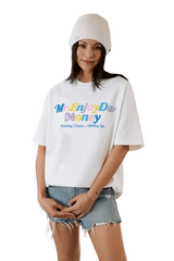 Model wearing MEDM SS25 Macaron Velvet Embossed Tee in white with colorful text and casual shorts