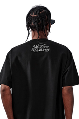 Back view of MEDM SS25 Rhinestone Tee by Mr Enjoy Da Money featuring logo detail on a black shirt