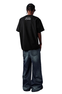 Men's black MEDM SS25 Rhinestone Tee featuring stylish logo design on the back