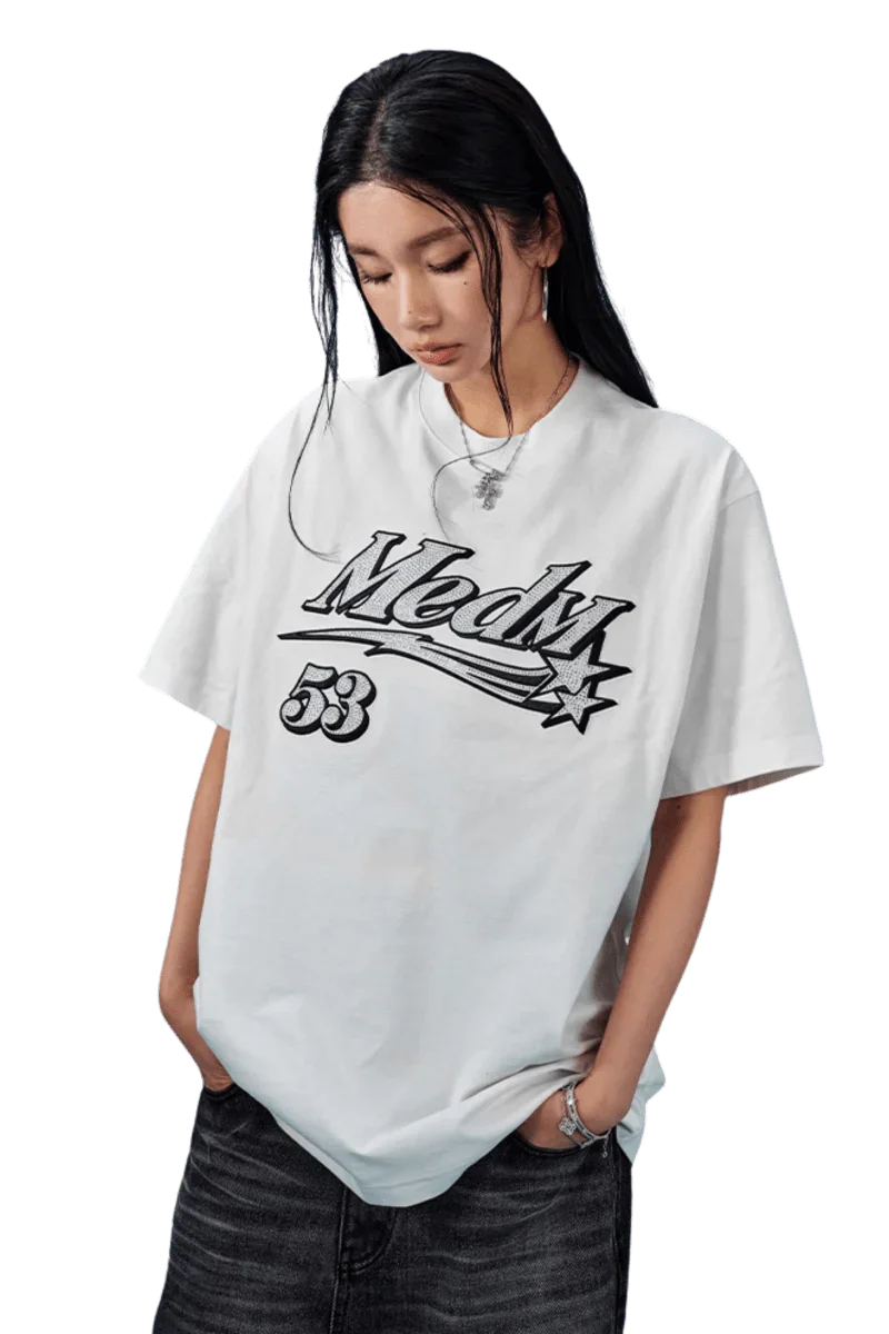 MEDM SS25 Rhinestone Tee in white featuring bold graphics and relaxed fit for stylish comfort