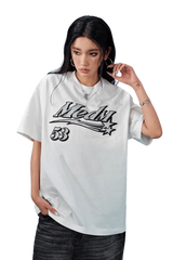 MEDM SS25 Rhinestone Tee in White, featuring bold logo design on a comfortable oversized fit