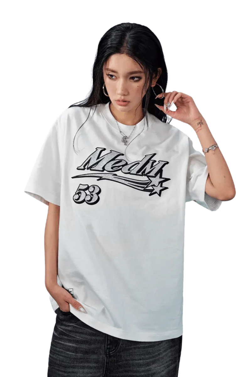 MEDM SS25 Rhinestone Tee in White, featuring bold logo design on a comfortable oversized fit