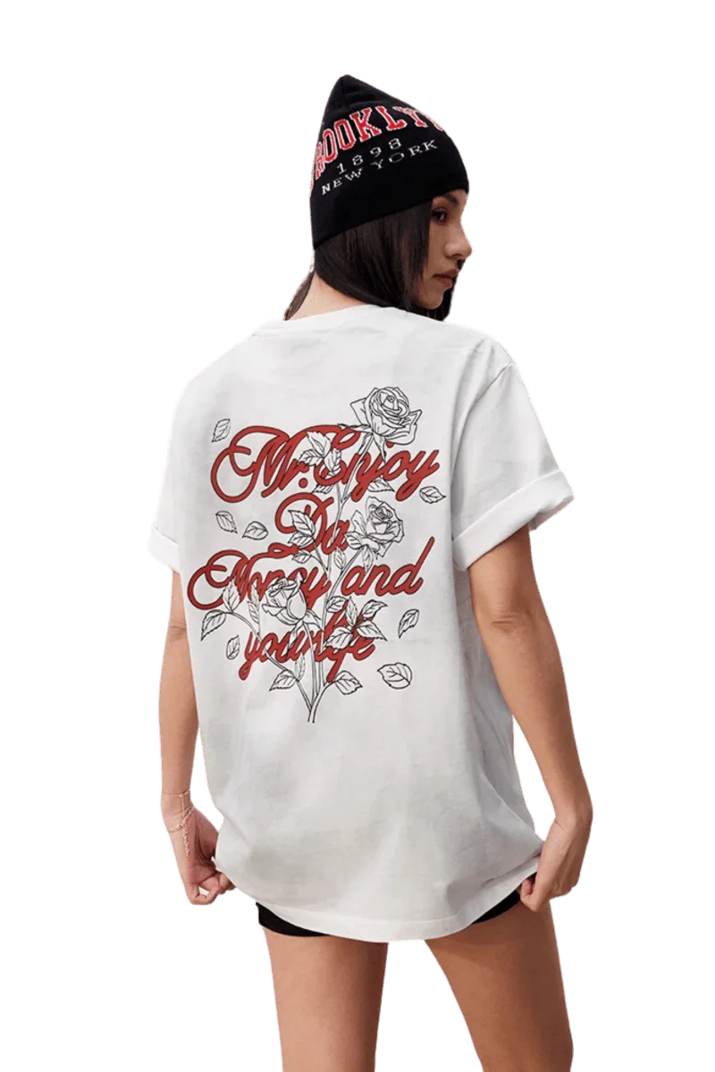 MEDM SS25 Rose Branch Stained Tee in white with floral design and bold lettering on the back