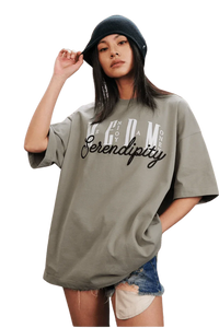 Model wearing a MEDM SS25 Serendipity Embroidery Tee in gray with stylish oversized fit