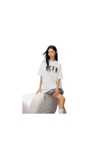 Model wearing MEDM SS25 Serendipity Embroidery Tee in white with stylish design and relaxed fit
