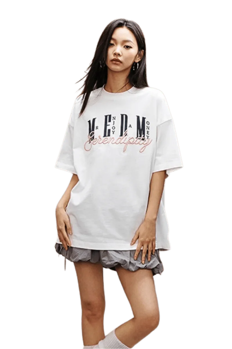 Model wearing MEDM SS25 Serendipity Embroidery Tee in white with stylish oversized fit