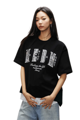 MEDM SS25 Small Pearl Tee in black featuring bold graphics and relaxed fit for casual style