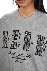 MEDM SS25 Small Pearl Tee in Grey with Pearl Embellishments and Bold Text Design