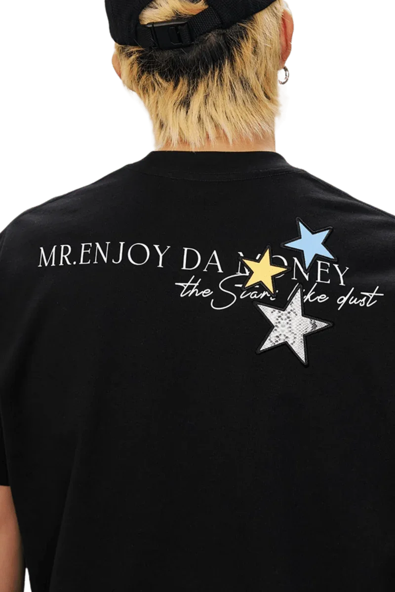 MEDM SS25 Snake Star Patch Tee featuring colorful star patches and a stylish graphic design on a black fabric