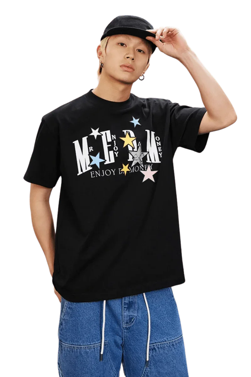 MEDM SS25 Snake Star Patch Tee in black featuring colorful stars and logo design