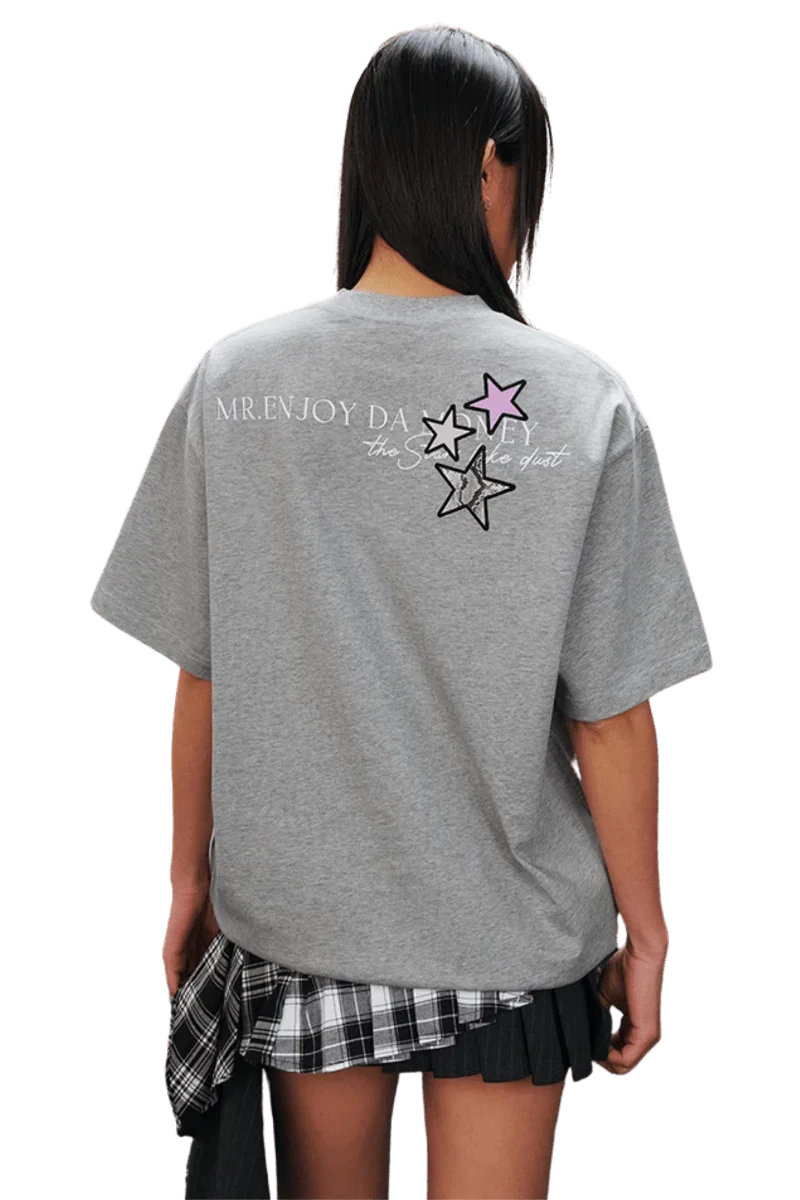 Back view of MEDM SS25 Snake Star Patch Tee in grey with colorful star patches and logo design
