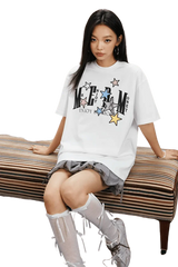 White MEDM SS25 Snake Star Patch Tee featuring colorful graphic design and relaxed fit style